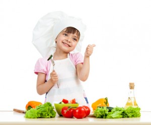 Chef girl preparing healthy food over white background